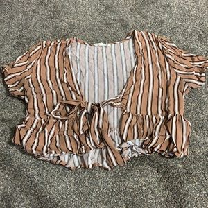Stripped crop top best warn with a black crop top underneath